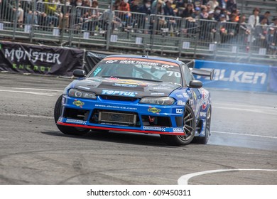 Tokyo, Japan - April 18, 2015: Masashi Yokoi Of D-MAX, Performs Drifting During The Round 1 Of D1 Grand Prix At Odaba Special Course.