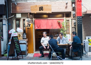 Tokyo, Japan - April 2014:
People Eating At Hawker Stand.