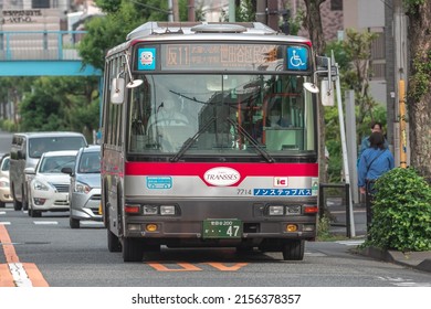 Tokyo, Japan - April, 2022: Tokyu Bus Driving On Street In Downtown Meguro To Pick Up And Drop Off Passenger During Rush Hour. Urban Transportation And Mass Transit Concept.