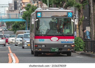 Tokyo, Japan - April, 2022: Tokyu Bus Driving On Street In Downtown Meguro To Pick Up And Drop Off Passenger During Rush Hour. Urban Transportation And Mass Transit Concept.