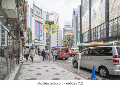 Tokyo, Japan - April 3, 2017: Pedestrians cross at Shibuya Crossing. It is one of the world's most famous and claim to be a busiest scramble crosswalks.