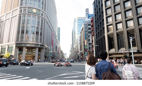 Tokyo, JAPAN - Aug 2018: Street View Of Ginza At Tokyo. Tourist Looking For Direction And Real Go Kart On The Street. Ginza Is A Famous Shopping District In Tokyo.