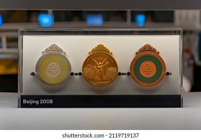 Tokyo, Japan - August 10 2021: Close Up On Official Gold, Silver And Bronze Medals Used During The Beijing 2008 Summer Olympics Exhibited In The Olympic Spirit Exhibition At Coredo Department Store.