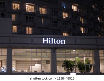 TOKYO, JAPAN - AUGUST 15TH, 2018. Illuminated Hilton Hotel Sign At Night In Odaiba.