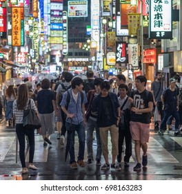 TOKYO, JAPAN - AUGUST 16TH, 2017. Crowd Of People At Kabukicho Red Light Area Street In Shinjuku During A Rainy Night,