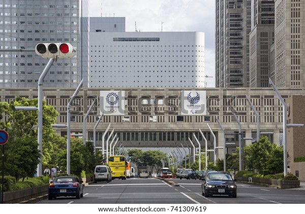 Tokyo, Japan - August 19, 2016: Cityscape of Tokyo\
with Olympic and Paralympic logos, which will be held in 2020,\
around the Tokyo metropolitan government building in Tokyo, Japan.\
\
