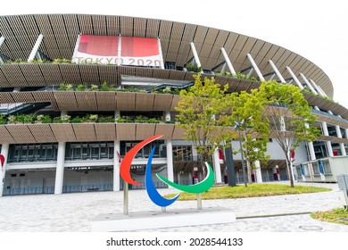 Tokyo, Japan - August 20, 2021: Exterior  view of Olympic stadium with sculpture of logo of Paralympic Games at Tokyo 2020 Summer Paralympic Games