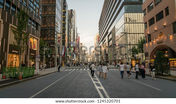 Tokyo, Japan - August 2018: Shopping district\
Ginza with famous Chuo Dori street that closes to cars on Sundays\
and becomes a pedestrian\
street
