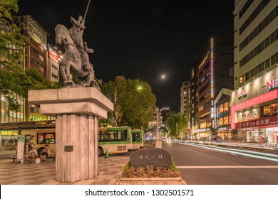 TOKYO, JAPAN - August 23 2018: Night view of the square in front of the Nippori train station in the Arakawa district of Tokyo with a statue of a horse ridden by Ota Dokan who created Imperial Palace.