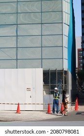 TOKYO, JAPAN - August 26, 2021: Street Corner In Tokyo's Nihonbashi Area With Fence In Front Of A Demolition Site Where Nishikawa Store Used To Be.