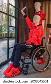 Tokyo, Japan - August 30 2021: Mannequin Depicting A Disabled Athlete Sitting On A Wheelchair And Wearing The Official Podium Jacket Of Japan Paralympic Team Exhibited At Paralympic Gallery Ginza.