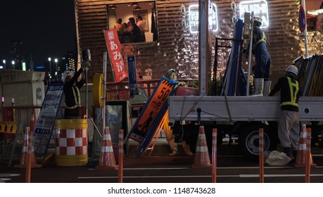 TOKYO, JAPAN - AUGUST 3RD, 2018. Road Construction Crew Working At Night In The Street Of Asakusa At Night.