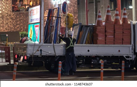 TOKYO, JAPAN - AUGUST 3RD, 2018. Road Construction Crew Working At Night In The Street Of Asakusa At Night.