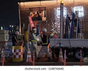 TOKYO, JAPAN - AUGUST 3RD, 2018. Road Construction Crew Working At Night In The Street Of Asakusa At Night.