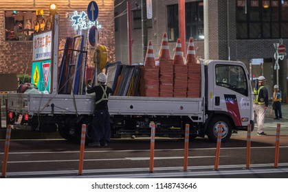 TOKYO, JAPAN - AUGUST 3RD, 2018. Road Construction Crew Working At Night In The Street Of Asakusa At Night.