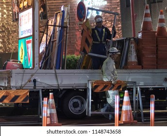 TOKYO, JAPAN - AUGUST 3RD, 2018. Road Construction Crew Working At Night In The Street Of Asakusa At Night.