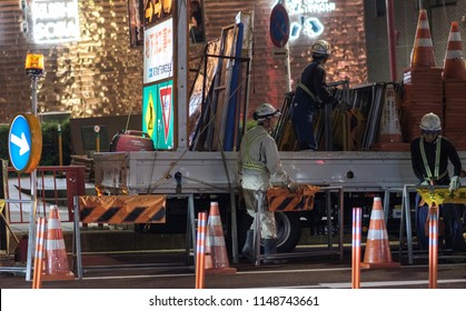 TOKYO, JAPAN - AUGUST 3RD, 2018. Road Construction Crew Working At Night In The Street Of Asakusa At Night.