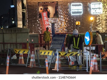 TOKYO, JAPAN - AUGUST 3RD, 2018. Road Construction Crew Working At Night In The Street Of Asakusa At Night.