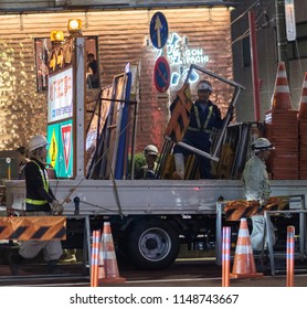 TOKYO, JAPAN - AUGUST 3RD, 2018. Road Construction Crew Working At Night In The Street Of Asakusa At Night.