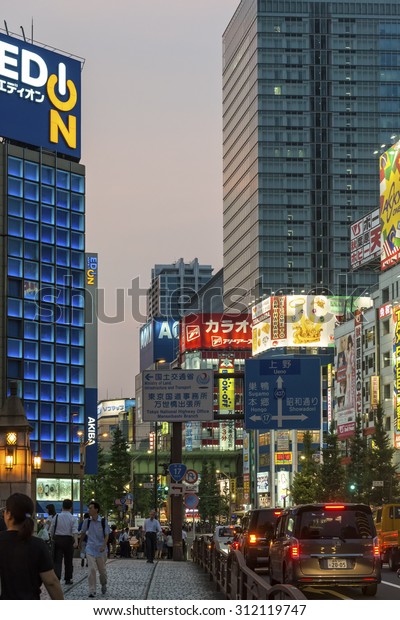 TOKYO, JAPAN - AUGUST Evening rush
hour traffic in Akihabara with the bright neon advertisements in
the background shown on August 7, 2015 in Tokyo,
Japan