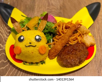 TOKYO, JAPAN - Ca. March 2018 - Food At The Pokémon Cafe In Nihonbashi, Pikachu Plate, Pikachu Omrice, Fried Shrimp, Noodles And Hamburg Steak On A Pikachu Shaped Plate