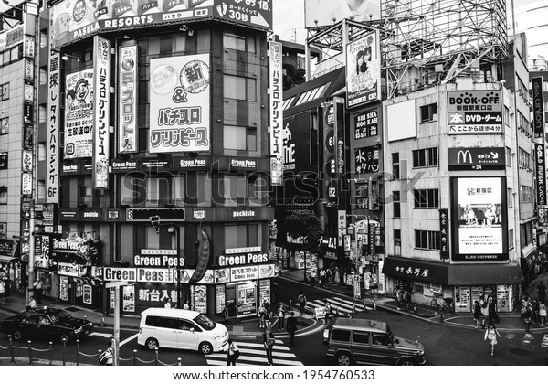 Tokyo, Japan - Circa 2015:\
Buildings, signs and traffic at Shinjuku district (in black and\
white)