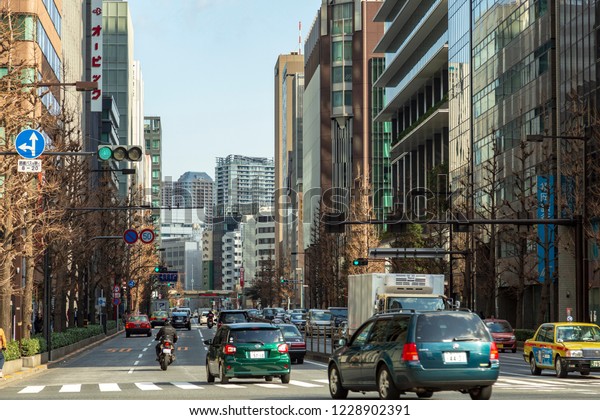 TOKYO, JAPAN - CIRCA, 2018: Cars in traffic on the\
street of Tokyo, Japan