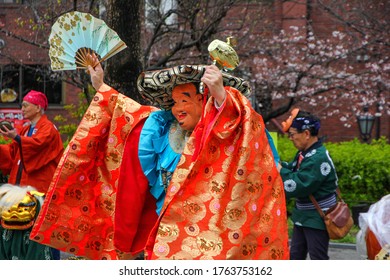 TOKYO , Japan – Circa June 2020. A Japanese Street Festival Showing A Masked Man Dancing.