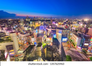 Tokyo, Japan city skyline over Shibuya Ward with the Shinjuku skyline in the distance. 