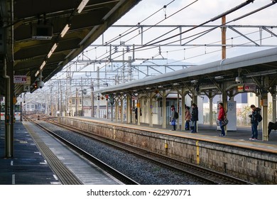 Tokyo, Japan - Dec 25, 2015. People waiting for the train at Hachioji railway station in Tokyo, Japan. Railways are the most important means of passenger transportation in Japan. - Shutterstock ID 622970771