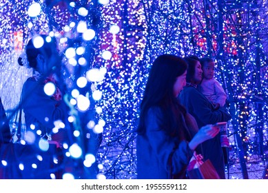 Tokyo, Japan - December 09, 2015: Visitors Adore The Christmas  Lights At Caretta Shopping Mall In Tokyo, Japan. 