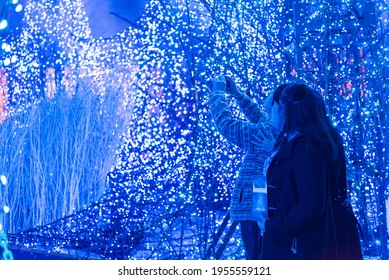 Tokyo, Japan - December 09, 2015: Visitors Adore The Christmas  Lights At Caretta Shopping Mall In Tokyo, Japan. 