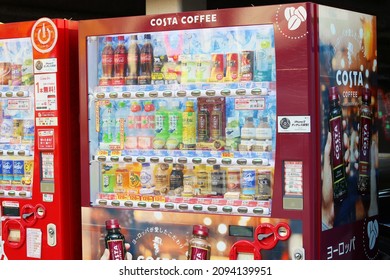 TOKYO, JAPAN - December 19, 2021: A Pair Of Drinks Vending Machine, One With A Costa Coffee Design, Stocked With Hot And Cold Drinks On A Street In Tokyo's Harajuku Area.