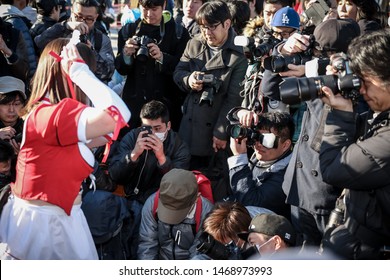 Tokyo, Japan - December 2017: Cosplayer Surrounded By Photographers At Comiket 93