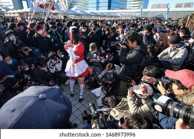 Tokyo, Japan - December 2017: Cosplayer Surrounded By Photographers At Comiket 93