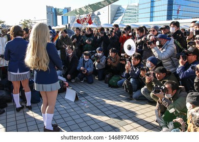 Tokyo, Japan - December 2017: Cosplayer Surrounded By Photographers At Comiket 93