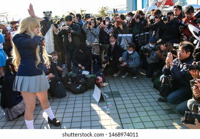 Tokyo, Japan - December 2017: Cosplayer Surrounded By Photographers At Comiket 93