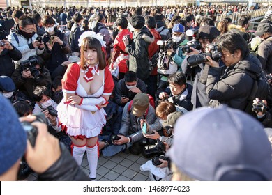 Tokyo, Japan - December 2017: Cosplayer Surrounded By Photographers At Comiket 93