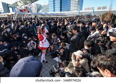 Tokyo, Japan - December 2017: Cosplayer Surrounded By Photographers At Comiket 93