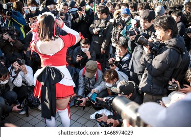 Tokyo, Japan - December 2017: Cosplayer Surrounded By Photographers At Comiket 93