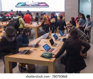 TOKYO, JAPAN - DECEMBER 21ST, 2017. Customers In Apple Store In Omotesando Ar Night.