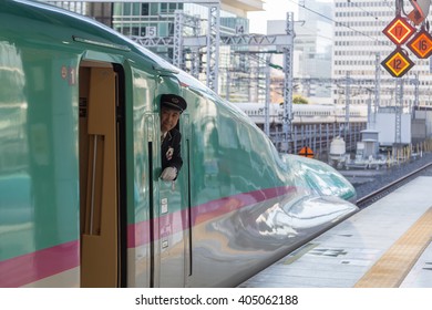 Tokyo, Japan - December 23, 2014: A Shinkansen Train Operator Looking Out Of The Window Before Departure.