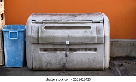 Tokyo, Japan - December 28 2021: A Grimy Plastic Storage Bin On A Tokyo Side Street.