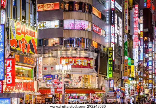 TOKYO, JAPAN - DECEMBER 29, 2012: Billboards in\
Shinjuku\'s Kabuki-cho district. The area is a nightlife district\
known as Sleepless Town.