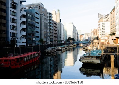 Tokyo, Japan - December 29 2020: View of Kanda River from Yanagibashi Bridge with yakatabune boats on teh river.
