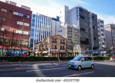 Tokyo, Japan - Jan 3, 2016. Cars on street at Taito District in Tokyo, Japan. At over 13 million people, Tokyo is the core of the most populated urban area in the world.