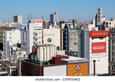 TOKYO, JAPAN - January 19, 2019: Overhead View Of Tokyo's Skyline In Asakusa With A Mixture Of Residential And Commercial Buildings Including Offices, A Car Park And A Karaoke Parlor.