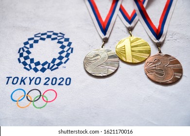 TOKYO, JAPAN, JANUARY. 20. 2020: Gold Silver And Bronze Medal Set, Olympic Logo Tokyo 2020 On White Background