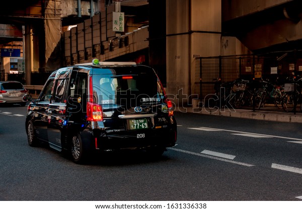 Tokyo, Japan - January 20, 2020: Japanese Taxi\
can slide the door open and close automatically. To facilitate the\
customers or tourists