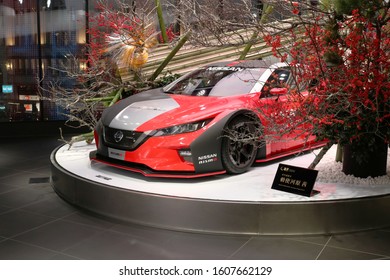 TOKYO, JAPAN - January 5, 2020: A Nissan NISMO Concept Car On Display At The Nissan Crossing Showroom In Ginza Place. There Is A Large Ikebana Bamboo Arrangement Around It.